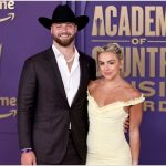Jake Ferguson’s fiancée Haley Cavinder flaunts blingy engagement ring while rocking cowboy boots and belted trench jumpsuit for Thanksgiving game