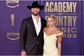 Jake Ferguson’s fiancée Haley Cavinder flaunts blingy engagement ring while rocking cowboy boots and belted trench jumpsuit for Thanksgiving game
