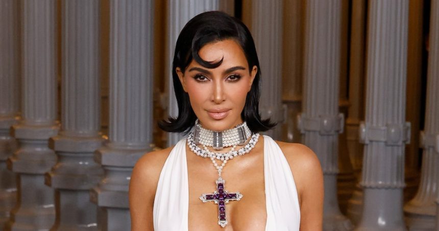 Kim Kardashian Stuns in Naked Dress as She Poses in Sheer Lace