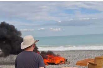 Man fined after being filmed burning rubbish on beach
