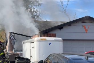 One person hospitalized after Littleton house fire Tuesday morning