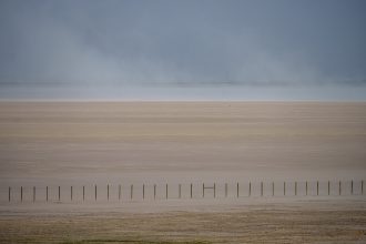 A drying Great Salt Lake is spewing toxic dust. It could cost Utah billions.