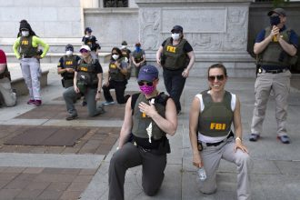 FBI agents sue after being fired for kneeling during racial justice protest : NPR