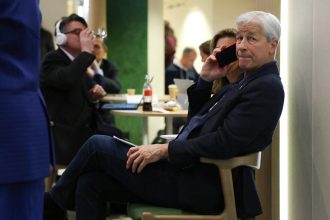 Jamie Dimon is now taking advice from Jeff Bezos and Condoleezza Rice