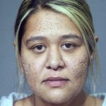 Judge detains woman accused of using child in insulin scam robberies