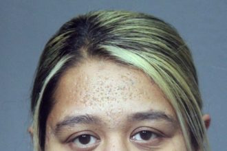 Judge detains woman accused of using child in insulin scam robberies