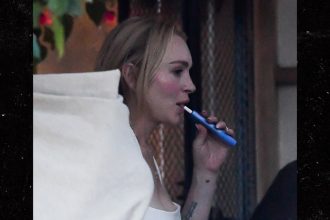 Lindsay Lohan Vapes, Eats Ice Cream in Miami With Husband, Son