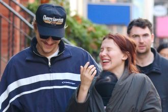 Millie Bobby Brown Bundles Daughter Under Her Coat on Walk with Jake Bongiovi