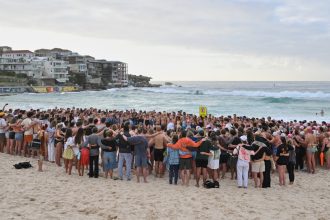 Suspected gunman in Bondi Beach shooting charged with 15 counts of murder : NPR