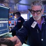 Wall Street pulls near its all-time high