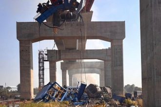 A construction crane falls onto a moving train in Thailand : NPR