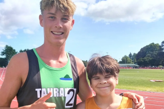 Athletics sensation Sam Ruthe guides visually impaired youngster to win