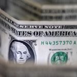 Dollar sinks to four-year low, Trump brushes off the decline