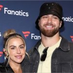 Jake Ferguson’s fiancée Haley Cavinder poses in maroon lace-and-sequin corset dress for golden hour snaps on beachside