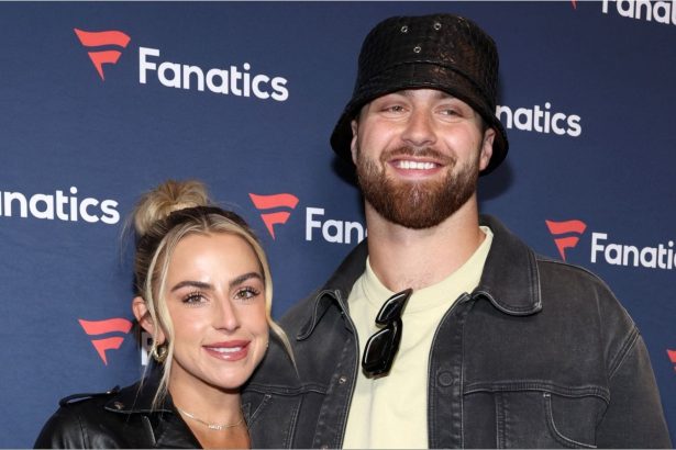 Jake Ferguson’s fiancée Haley Cavinder poses in maroon lace-and-sequin corset dress for golden hour snaps on beachside