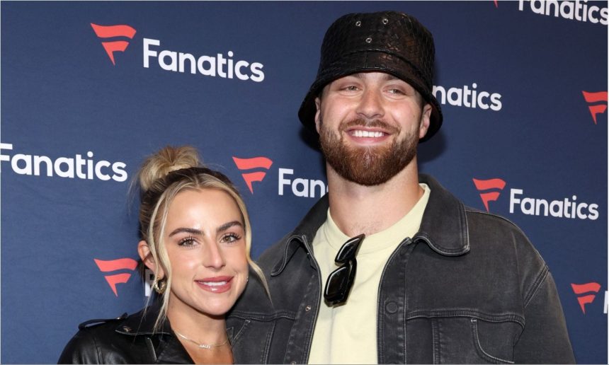 Jake Ferguson’s fiancée Haley Cavinder poses in maroon lace-and-sequin corset dress for golden hour snaps on beachside