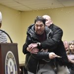 Rep. Ilhan Omar rushed on stage and sprayed with liquid at town hall event : NPR