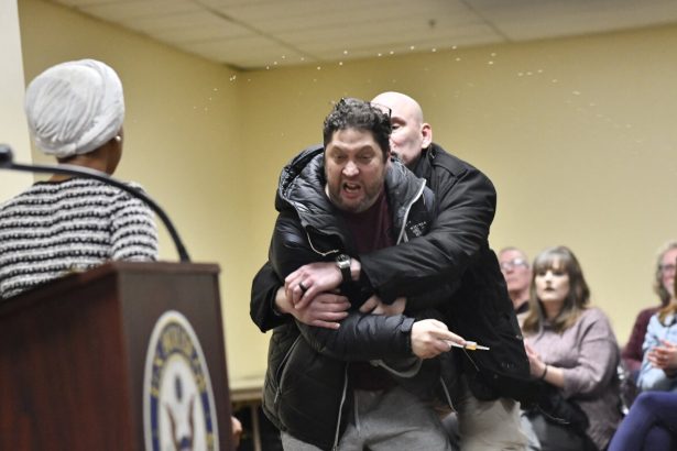 Rep. Ilhan Omar rushed on stage and sprayed with liquid at town hall event : NPR