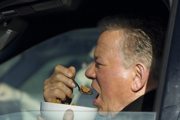 William Shatner Photographed Eating Bowl of Cereal in His Car at Stop Light