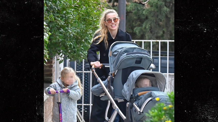 Amber Heard All Smiles as Johnny Depp Films Hollywood Return