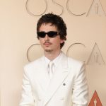 Timothée Chalamet Goes Full Y2K Boy Band in a White Suit and Goatee on the 2026 Oscars Red Carpet