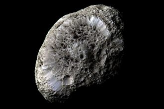 A Titan collision may link Saturn’s tilt, its moon Hyperion and its rings