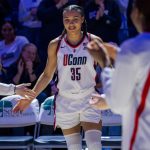 College Hoops fans lose their minds as Azzi Fudd turns heads in fur coat at Unrivaled semifinals