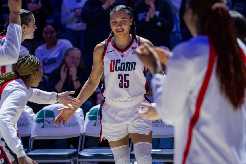 College Hoops fans lose their minds as Azzi Fudd turns heads in fur coat at Unrivaled semifinals