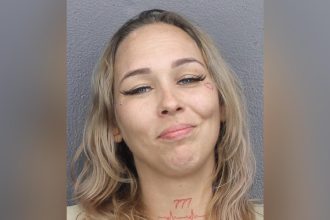 Florida woman grins in mugshot after shooting sister during fight