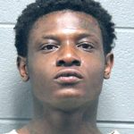 Chicago man charged with robbing delivery drivers while AWOL from gun case