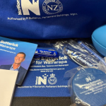 MP under fire for giving school kids bags of National Party swag