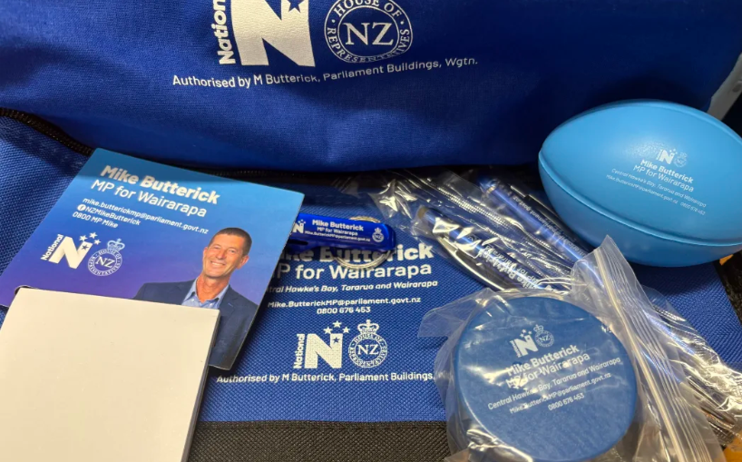 MP under fire for giving school kids bags of National Party swag