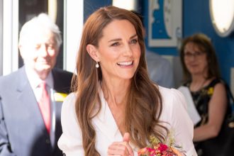 Kate Middleton’s White Dress Style Conceals the Upper Arms