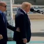 Trump Is So Out Of It At The NATO Summit That He Is Being Guided Around By Hand