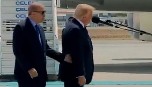 Trump Is So Out Of It At The NATO Summit That He Is Being Guided Around By Hand