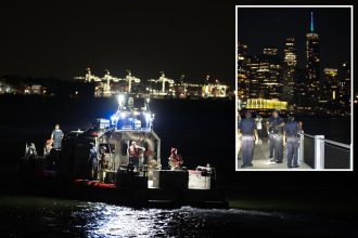 Boat overturns off Liberty Island coast; woman and child dead as more than a dozen pulled from water: sources